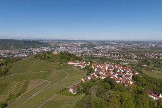 Panorama of a town with vineyards and red roofs under a clear sky, view of Rotenberg near Stuttgart
