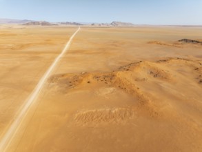 The C14 gravel road at the edge of the Namib Desert. Aerial view. Drone shot. Namibia
