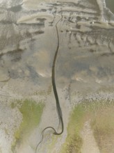 Marshes and streams at low tide in the Walvis Bay Lagoon. Aerial view. Drone shot. Namibia