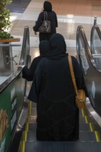Shrouded woman with handbag, Abu Dhabi, United Arab Emirates