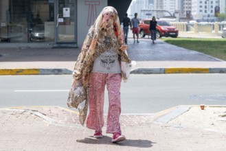 Woman fashionably veiled, Abu Dhabi, United Arab Emirates