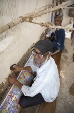 Indian men weaving a carpet, Jaipur, Rajasthan, India