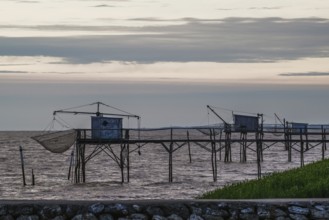 Sunset over Fishing huts over Randonnee entre Histoire et Nature, Fouras, Fouras-les-Bains,