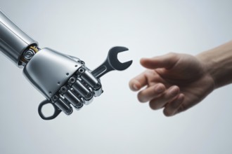 Robot hand with wrench work tool and man's hand. Concept of AI either assisting or replacing human