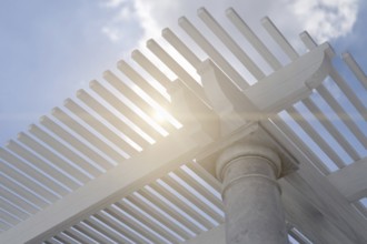 Detail of A beautiful marble and wood pergola patio cover