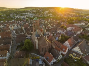 A bird's eye view of the evening cityscape with church at sunset, 950 years Weil der Stadt