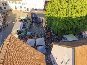 Aerial view of a large open-air event with many visitors and a stage, 950 years Weil der Stadt