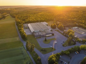 Industrial area at sunset, surrounded by nature and roads, Sektkellerei Schnaufer, Althengstett