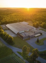 Industrial building at sunset, embedded in green nature, Sektkellerei Schnaufer, Althengstett Calw