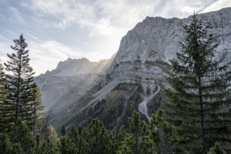 Sunbeams fall over a rocky mountain ridge, Mountain landscape in autumn in the morning light, Rocky