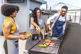 Chefs grilling delicious barbecue food for a rooftop party, preparing vibrant vegetables and savory