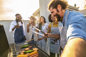 Chefs grilling food and taking a selfie on a rooftop at sunset, enjoying a barbecue party with