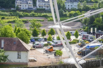 View of the town and parked vehicles from a Ferris wheel, Ferris wheel construction, Calw, Black