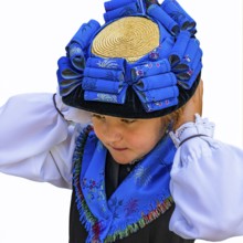 Young girl in traditional traditional costume and with traditional hat, Grimentz, Val d'Anniviers,