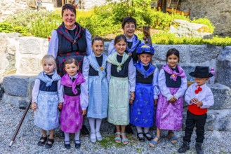 Women and children in traditional costumes, historic village centre, Grimentz, Val d'Anniviers,
