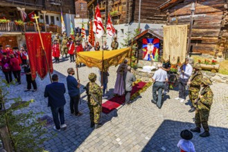 The priest celebrates a service at the flower-decorated altar during the Corpus Christi procession,
