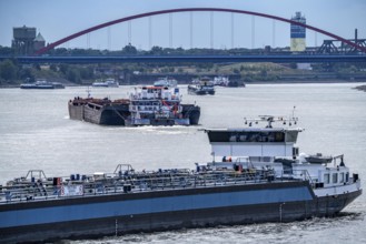 Cargo ships on the Rhine, in the background the Rhine bridge near Duisburg-Rheinhausen, Bridge of