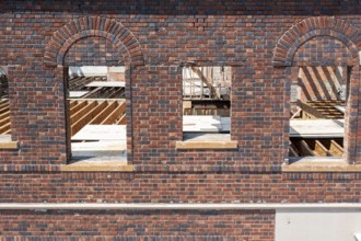 Detroit, Michigan - Workers rehab a long-vacant and crumbling commercial building in the