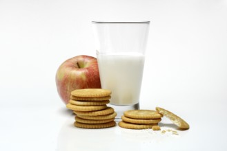 Cracker with glass of milk and apple
