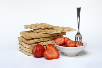 Crispbread and bowl of strawberries