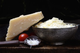 Parmesan cheese, grated cheese in rind and piece of Parmesan, Italy