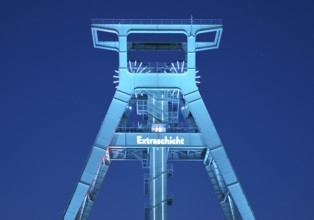 Illuminated headframe of the German Mining Museum at Extraschicht, Bochum, Ruhr area, North