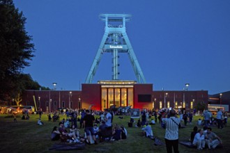 People in front of the German Mining Museum for the Extra Shift at night, Bochum, Ruhr Area, North