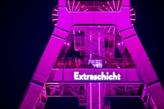 Illuminated headframe of the German Mining Museum with people, Extraschicht, Bochum, Ruhr area,
