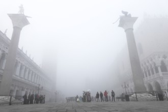 Theodorus and Lion Column in the Piazetta in the fog, Venice, Veneto, Italy