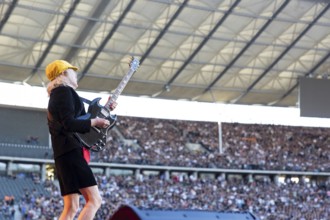 Angus Young, lead guitarist of AC/DC live on Power Up Tour 2025 at the Olympiastadion Berlin on 30