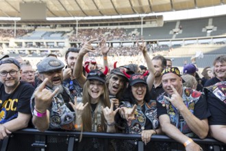 Fans in the front row in front of the concert of AC/DC live on Power Up Tour 2025 at the