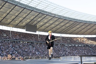 Angus Young, lead guitarist of AC/DC live on Power Up Tour 2025 at the Olympiastadion Berlin on 30