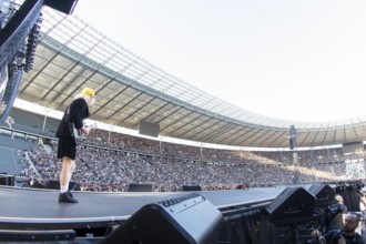 Angus Young, lead guitarist of AC/DC live on Power Up Tour 2025 at the Olympiastadion Berlin on 30