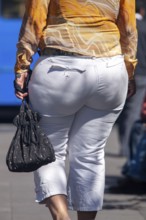 Woman walking in the street, From behind, Obesity, City of Quito. Pichincha province, Ecuador,