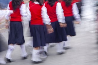 Group of female students walking to the college, Motion blur, City of Otavalo, Imbabura province,