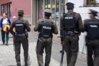 Policemen walking in the street, Motion blur, City of Quito. Pichincha province, Ecuador, South