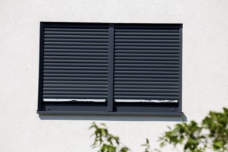 Electric aluminium roller shutter on a residential building