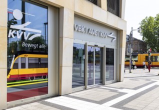Office of the KVV, Karlsruhe Transport Association. Tram on the move in the city centre. Karlsruhe,