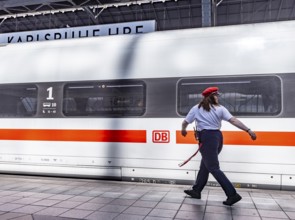 Karlsruhe main station with ICE and employee of Deutsche Bahn AG. Karlsruhe, Baden-Württemberg,