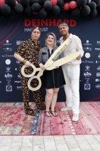 Julian F. M. Stöckel, Janine Becker and Marcell Damaschke at the VIP opening of the new Deinhard