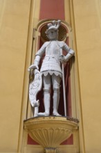 Sculpture of the giant Haymon, founder of the monastery, at the entrance portal of Wilten Abbey,