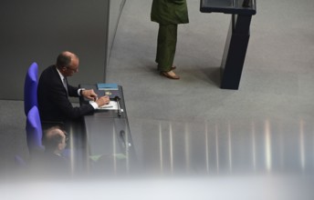 Federal Chancellor Friedrich Merz (CDU) and parts of his cabinet sit on the government bench,