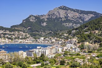 View at the idyllic coast village Port de Soller a famous tourist resort with houses around the