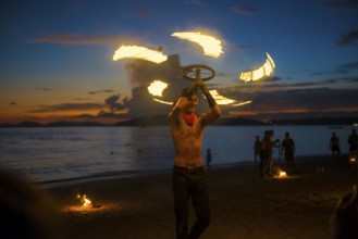Fire show, jugglers with fire, Ao Nang Beach, sunset, Ao Nang, Krabi, Thailand