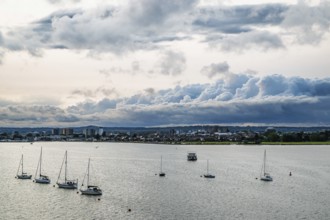Yachts over Ramshorn Lake and Poole, Brownsea, Dorset, England, United Kingdom