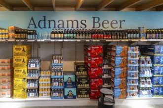 Adnams beer products on display inside brewery shop, Southwold, Suffolk, England, UK