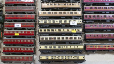 Model railway toy train set items on display for sale at auction room, UK