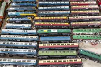 Model railway toy train set items on display for sale at auction room, UK