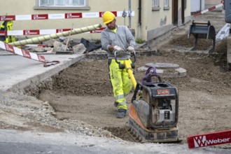 Construction site Road construction Construction worker Vibratory plate