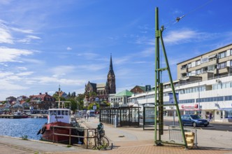 South harbour with house front and church, Lysekil, Bohuslän, Västra Götalands län, Sweden,
